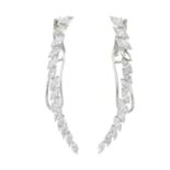 A pair of 18ct gold marquise-shape diamond shaped earrings.One diamond deficient.Estimated total