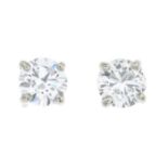 A pair of brilliant-cut diamond single-stone earrings.One diamond Laser inscribed 5106456355,