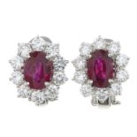 A pair of 18ct gold ruby and brilliant-cut diamond cluster earrings.Total ruby weight 2cts,