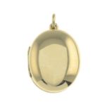 An oval locket, by Tiffany & Co.Signed Tiffany & Co.Stamped 585.Length 3.5cms.