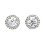 A pair of brilliant-cut diamond cluster earrings.Estimated total diamond weight 1.43cts,