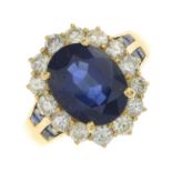 A sapphire and brilliant-cut diamond cluster ring.sapphire calculated weight 3.95cts,