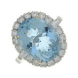 An 18ct gold aquamarine and vari-cut diamond dress ring.Aquamarine calculated weight 5.93cts,