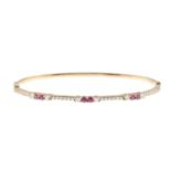 A ruby and brilliant-cut diamond bangle,