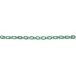 An 18ct gold emerald and brilliant-cut diamond line bracelet.Emerald weight 6.41cts.Diamond weight