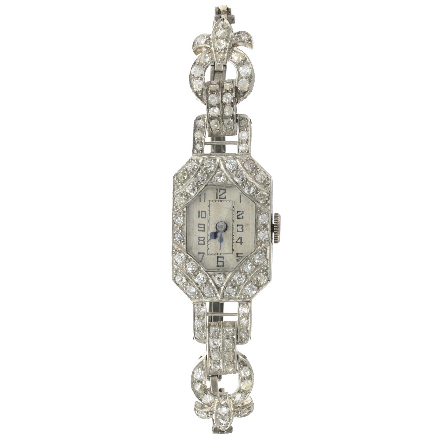 A mid 20th century platinum old-cut diamond cocktail watch.Estimated total diamond weight 2cts,