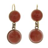 A pair of early 20th century 18ct gold coral earrings.Stamped 18ct.Length 3.5cms.