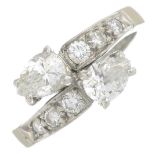 A platinum vari-cut diamond crossover ring.Estimated total diamond weight 1.15cts,