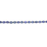 An 18ct gold sapphire and brilliant-cut diamond line bracelet.Total sapphire weight 10.55cts.Total