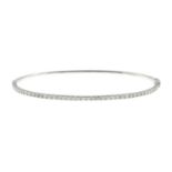 A brilliant-cut diamond bangle, hinged to the plain reverse.