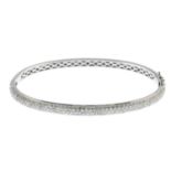 A 9ct gold pave-set diamond bangle, hinged to plain reverse.Estimated total diamond weight 2cts.