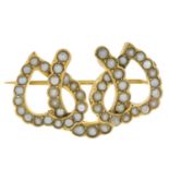 An early 20th century gold split pearl horseshoe brooch.Length 2.8cms.