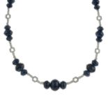 An 18ct gold sapphire cabochon and brilliant-cut diamond geometric necklace.Total sapphire weight