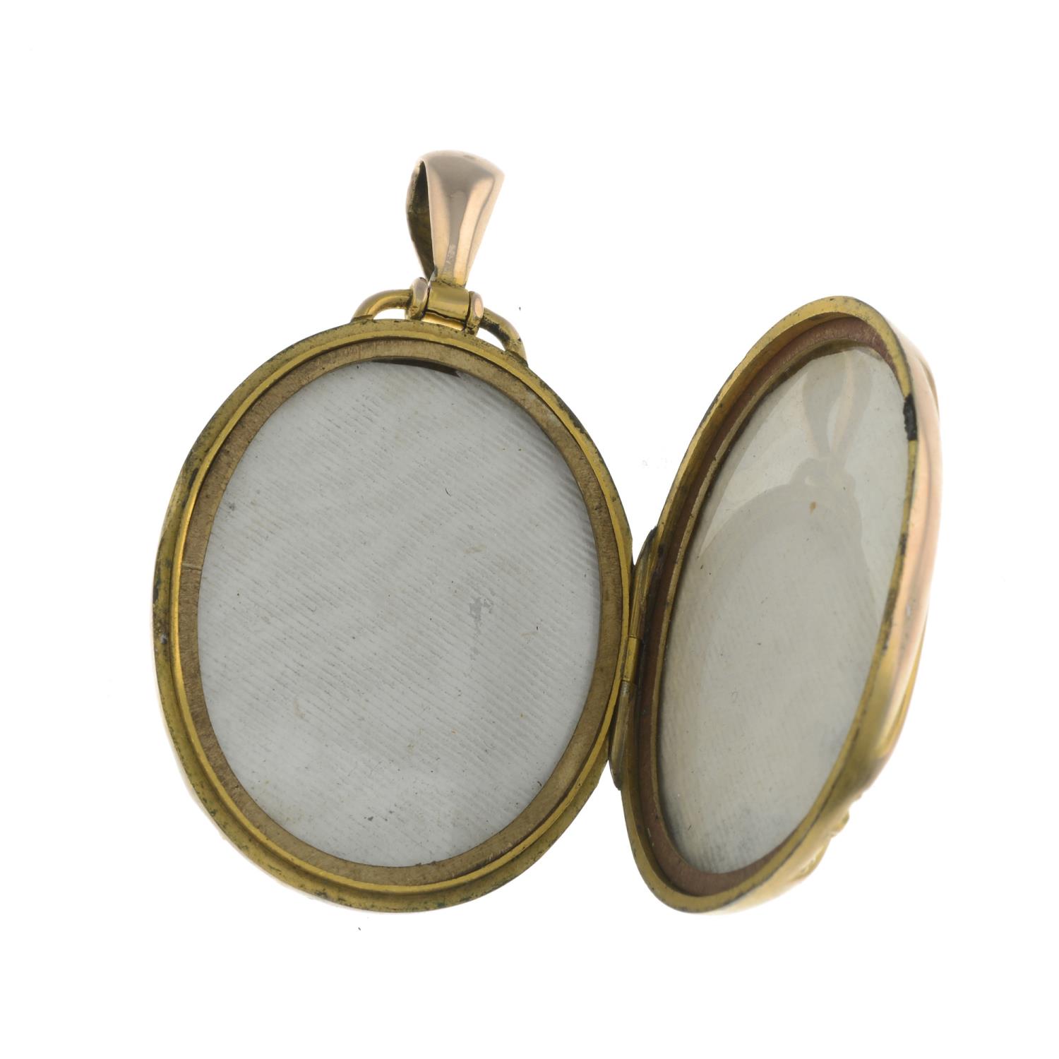 A late Victorian gold coral and split pearl locket.Length 6cms. - Image 2 of 3