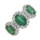 An 18ct gold emerald and brilliant-cut diamond dress ring.Total emerald weight 1.66cts.Total