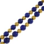 A lapis lazuli bead necklace.Length 76cms.