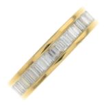 A baguette-cut diamond full eternity ring.Total diamond weight 1.14cts,