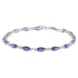 A sapphire and brilliant-cut diamond line bracelet.Total sapphire weight 8.07cts.Total diamond