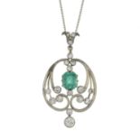 An emerald and old-cut diamond pendant, suspended from a chain.