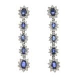 A pair of sapphire and brilliant-cut diamond cluster drop earrings.Total sapphire weight