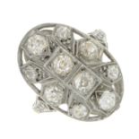 A mid 20th century platinum old-cut diamond cluster ring.Estimated total diamond weight 1.35cts,