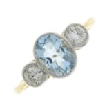 An aquamarine and brilliant-cut diamond three-stone ring.Aquamarine calculated weight 1.05cts,