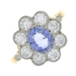 A sapphire and brilliant-cut diamond cluster ring.Calculated sapphire weight 1.17cts,