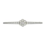 An early 20th century 15ct gold and platinum old-cut diamond bar brooch.Estimated total diamond