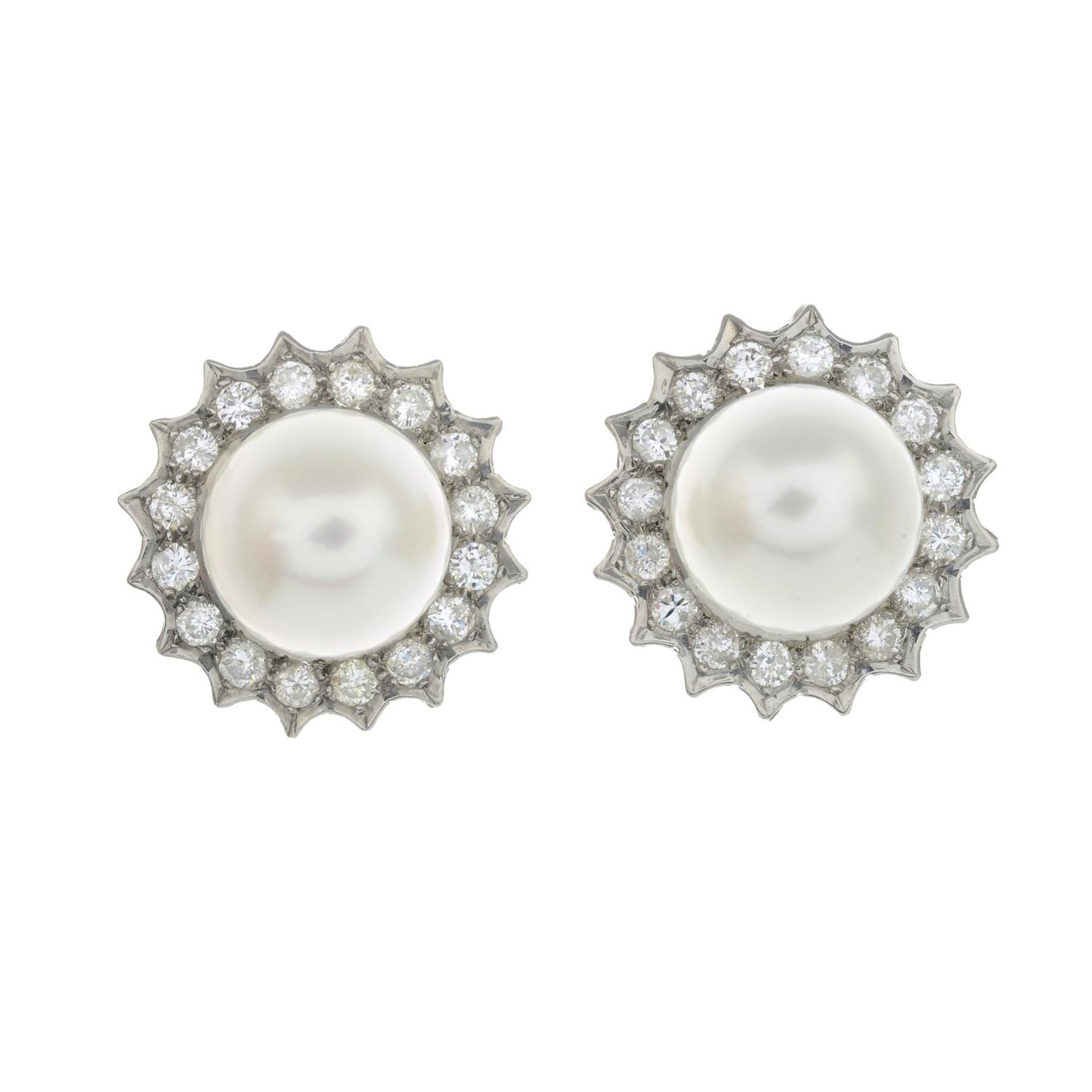 A pair of cultured pearl and brilliant-cut diamond cluster earrings.Estimated total diamond weight