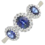 A sapphire and brilliant-cut diamond dress ring.Total sapphire weight 0.84ct.