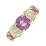 An 18ct gold ruby and old-cut diamond five-stone ring.Principal ruby calculated weight 0.74ct,