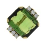 A green tourmaline and brilliant-cut diamond ring.Tourmaline weight 9.65cts.Estimated total diamond