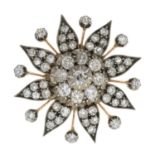 A late 19th century silver and gold old-cut diamond flower brooch.Estimated total diamond weight