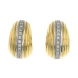 A pair of brilliant-cut diamond grooved hoop earrings.Estimated total diamond weight 0.25ct.Italian