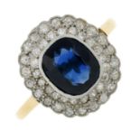 A sapphire and circular-cut diamond cluster ring.Sapphire calculated weight 2.12cts,