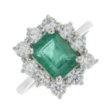 An 18ct gold emerald and brilliant-cut diamond cluster ring.Emerald calculated weight 1.98cts,