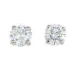 A pair of brilliant-cut diamond single-stone stud earrings.Total diamond weight 0.85ct,