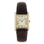 CARTIER - a mid-size Must De Cartier Tank wrist watch.