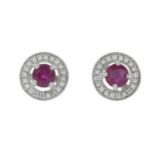 A pair of 18ct gold ruby and diamond cluster earrings.