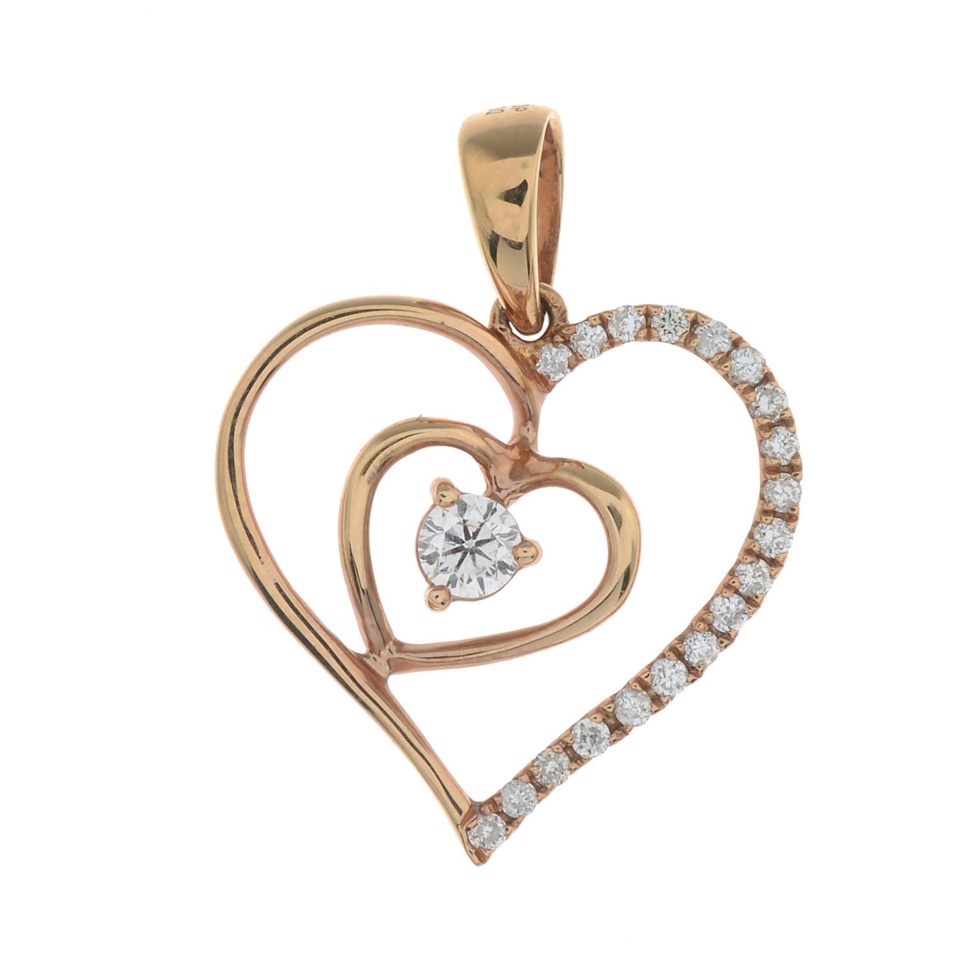 A diamond heart pendant.Total diamond weight 0.15ct, stamped to mount.