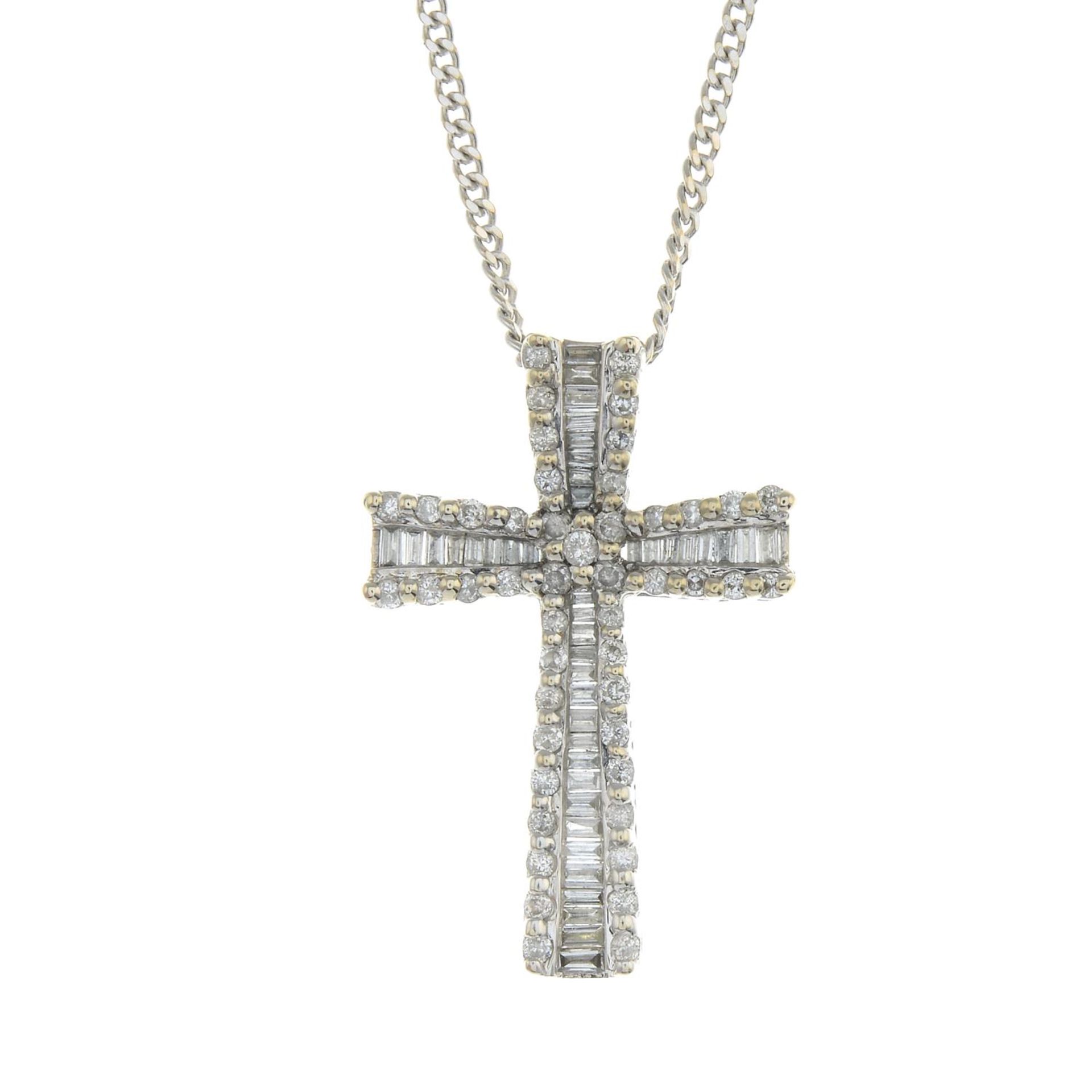A vari-cut diamond cross-pendant,