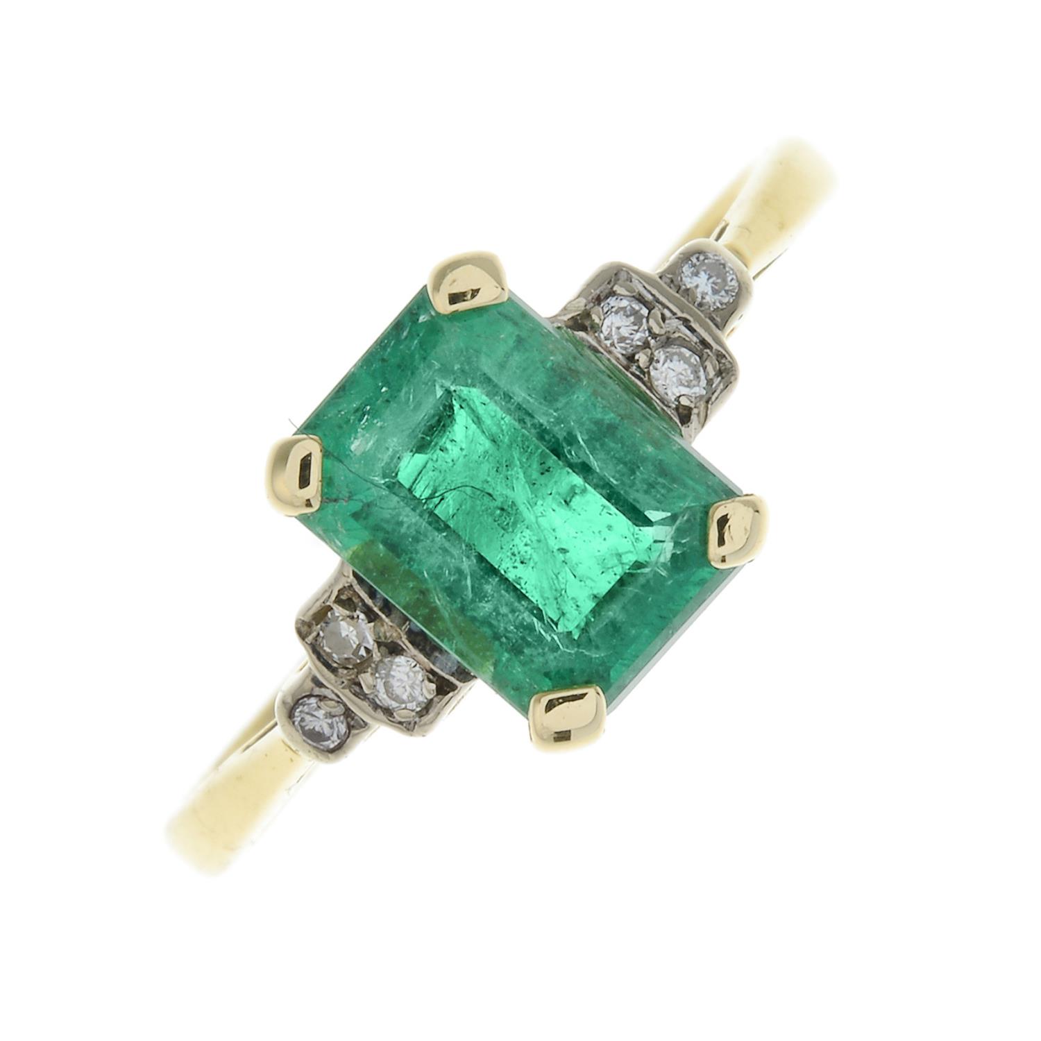 An 18ct gold emerald and diamond ring.