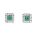 A pair of 18ct gold emerald and diamond cluster earrings.