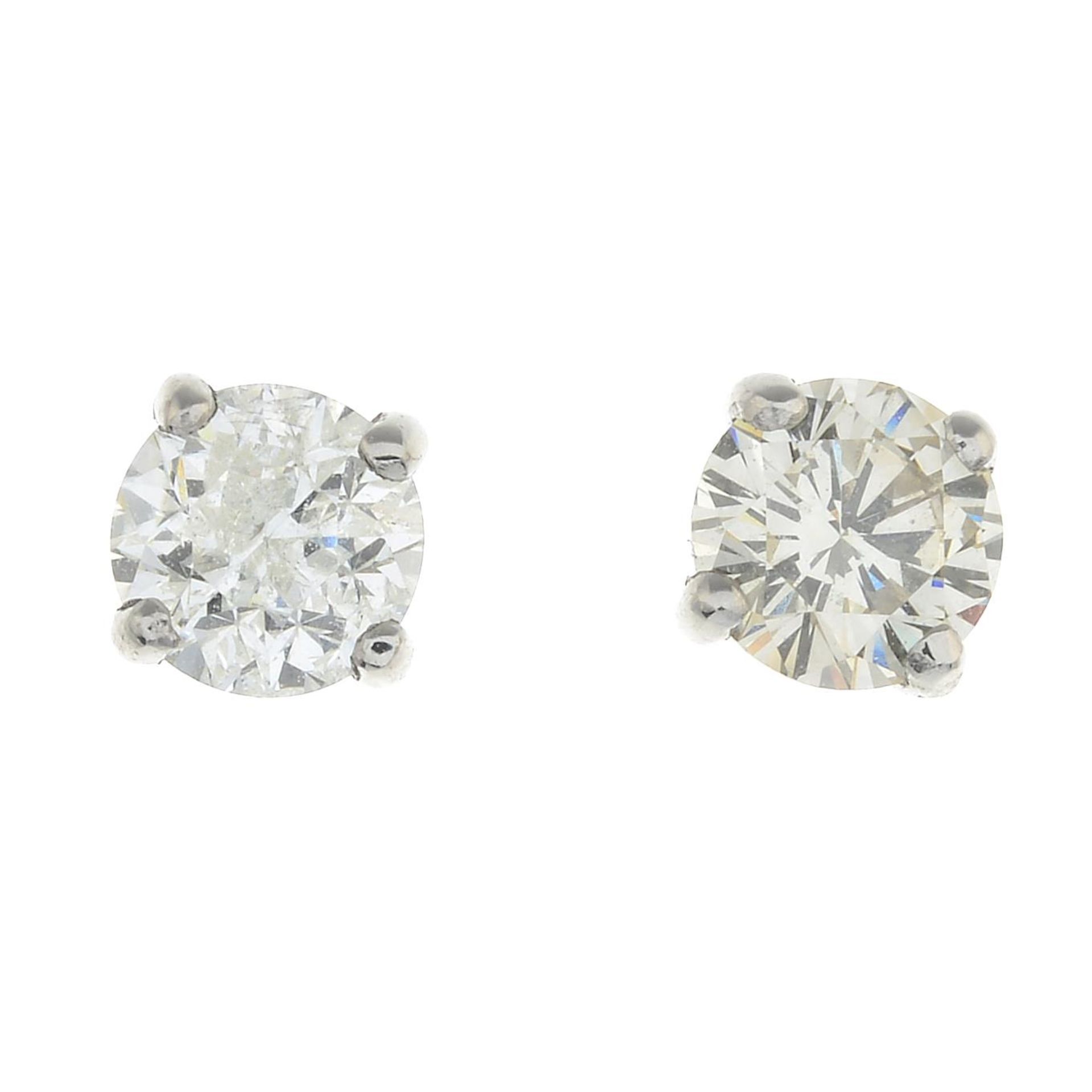 A pair of brilliant-cut diamond stud earrings.Estimated total diamond weight 0.85ct,