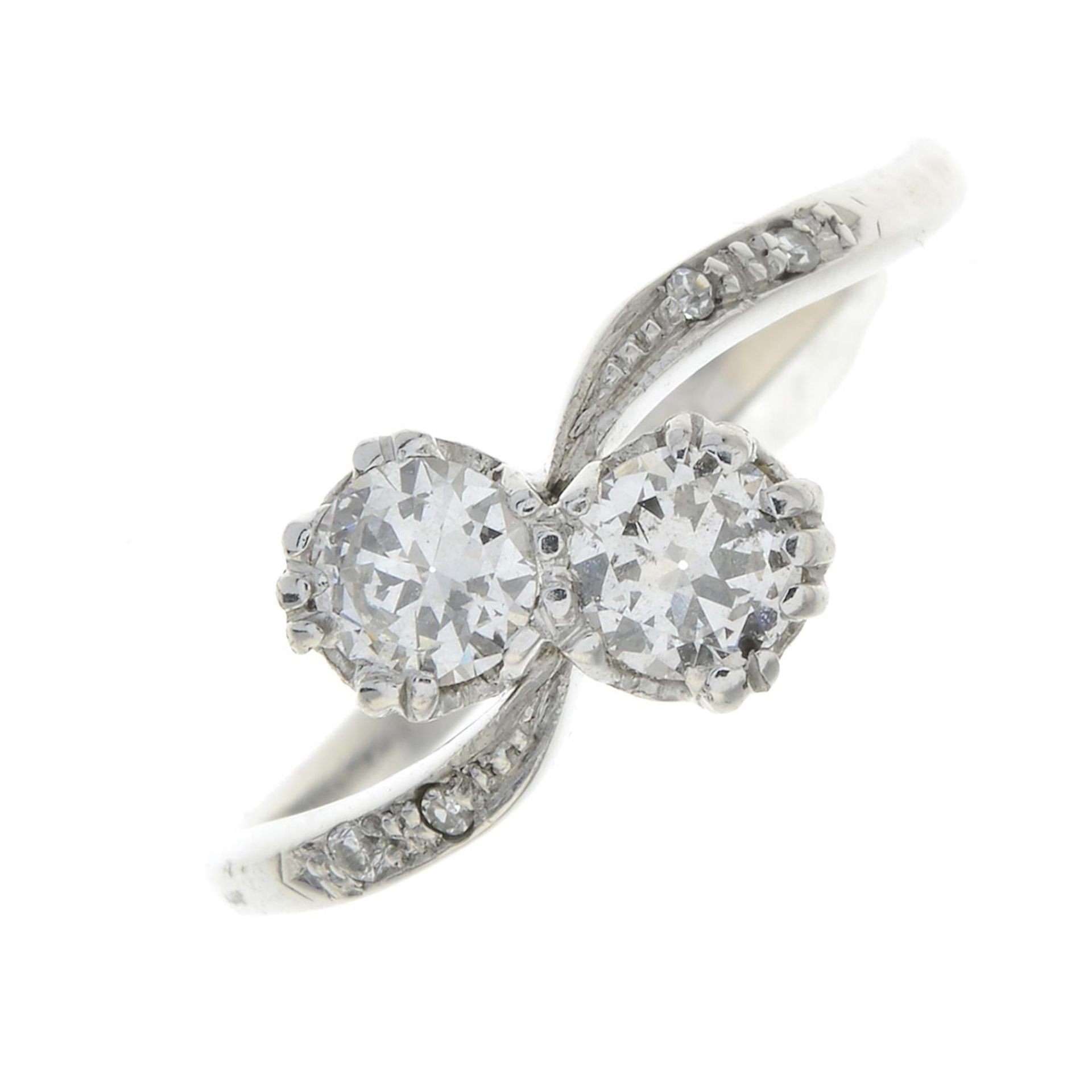 A diamond two-stone ring.Estimated total diamond weight 0.50ct,