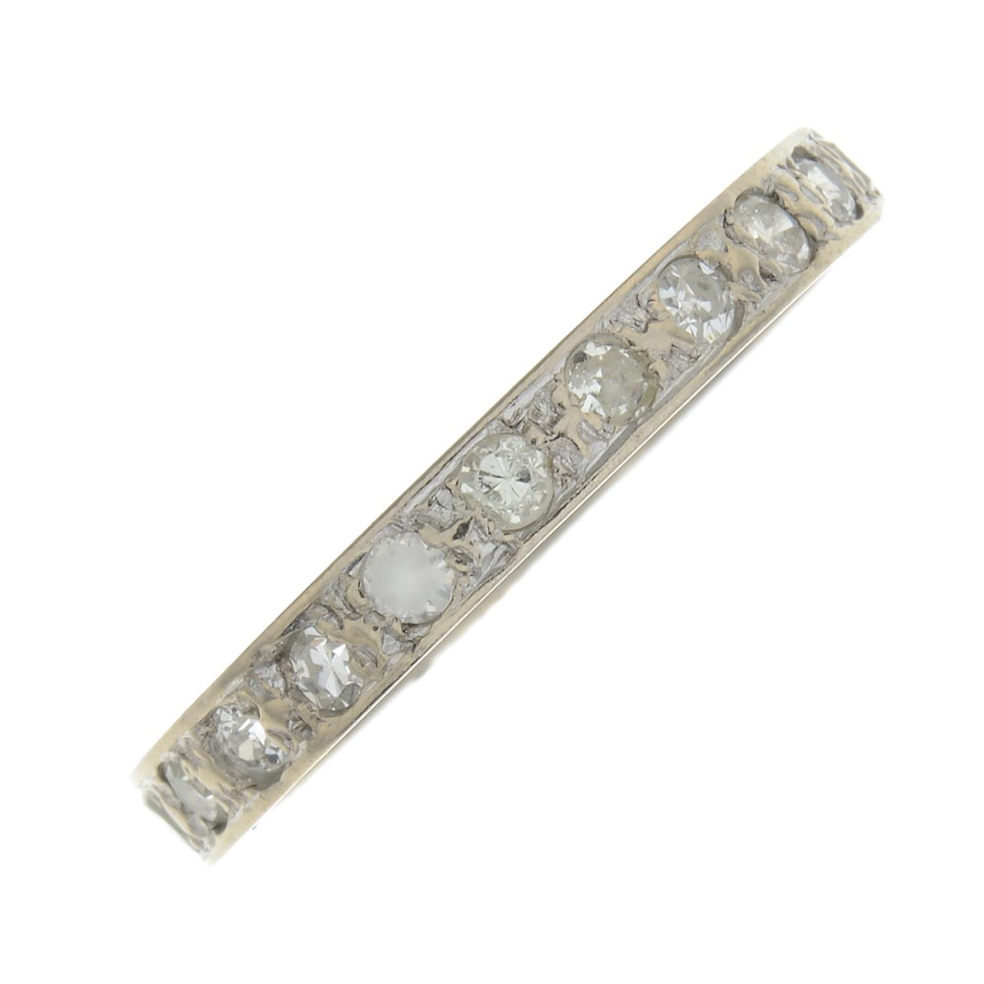 A diamond and colourless gem full eternity ring.Ring size M.