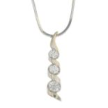 A diamond three-stone pendant,