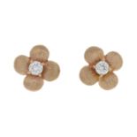 A pair of 18ct gold diamond floral earrings.