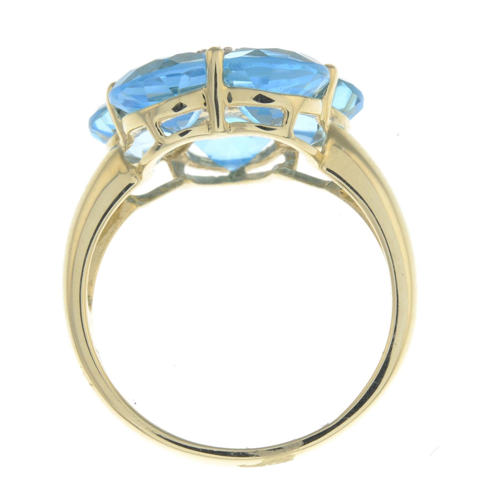 A 9ct gold blue topaz and diamond floral dress ring. - Image 2 of 2