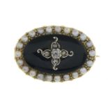 A late 19th century gold diamond, onyx and split pearl mourning brooch.Length 2.2cms.